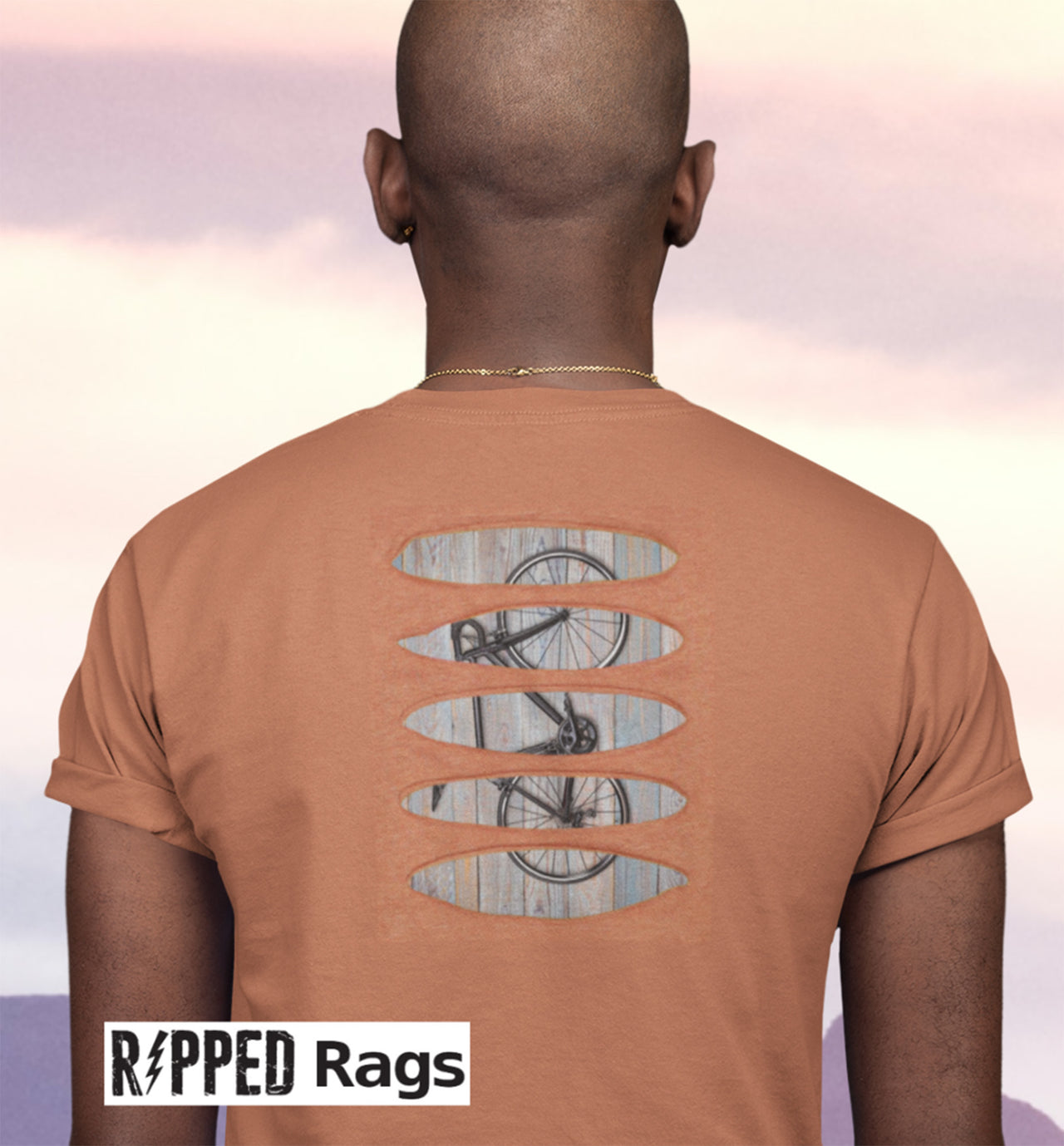 Ripped Rags cut back t-shirt features a road bike patch sewn behind the open rips.